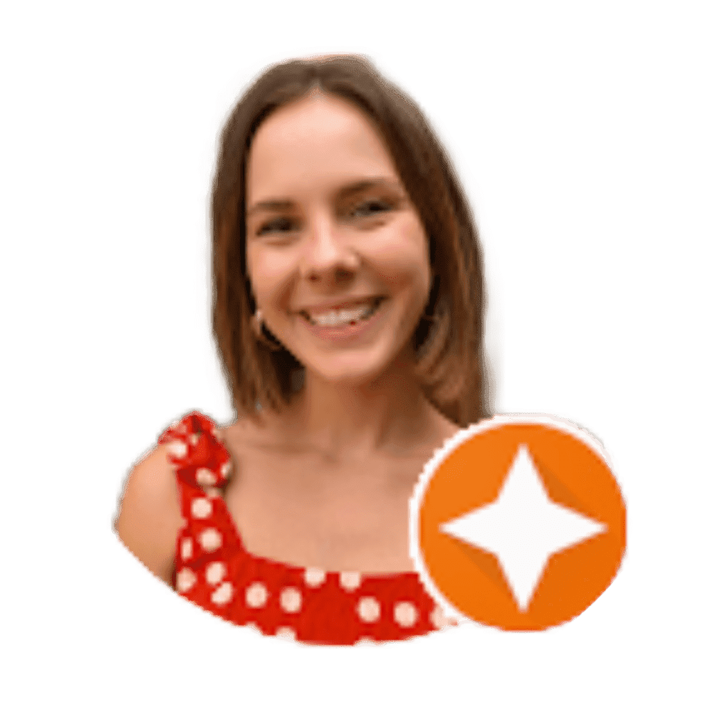 A woman smiling for the camera with an orange star in front of her.