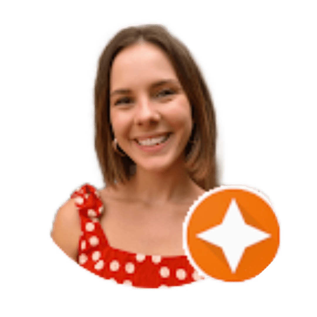 A woman smiling for the camera with an orange star in front of her.