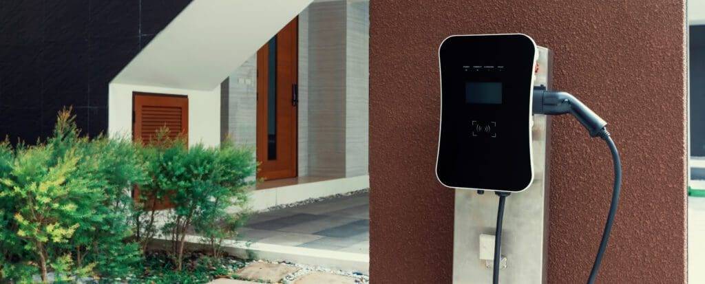 A parking meter on the side of a building.