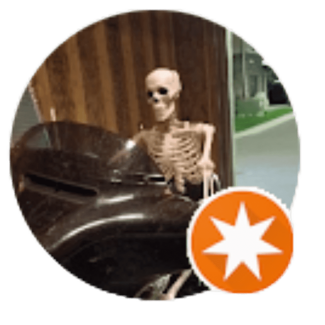 A skeleton sitting on top of a chair.