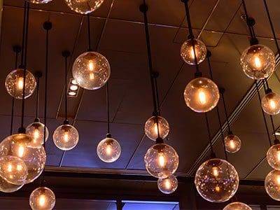 A bunch of lights hanging from the ceiling